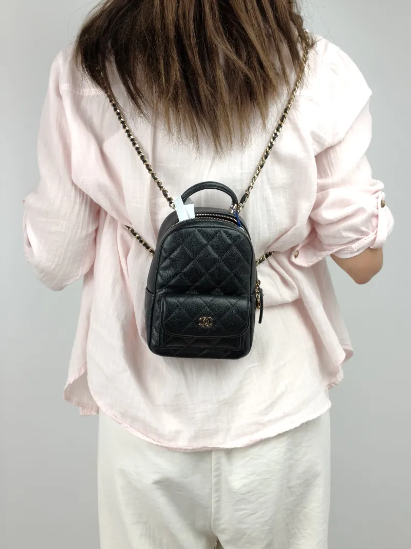Chanel Backpack mini Backpack Collection Black with Gold-Tone Hardware Grained Calfskin One Size 13 × 9 × 18 cm — on-model view 2 of 3