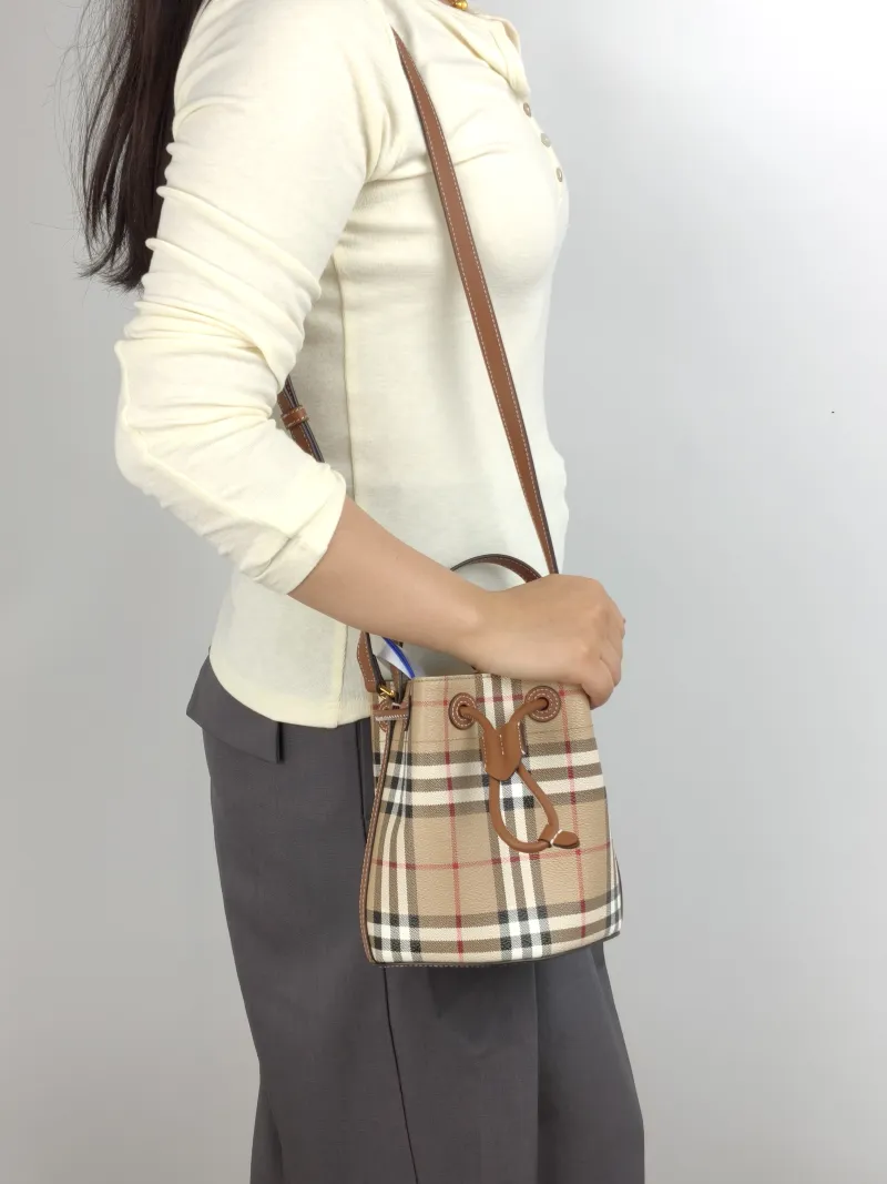 BURBERRY Crossbody Bag Bucket Bag Monogram PVC One Size 17 × 11 × 18 cm — on-model view 2 of 3