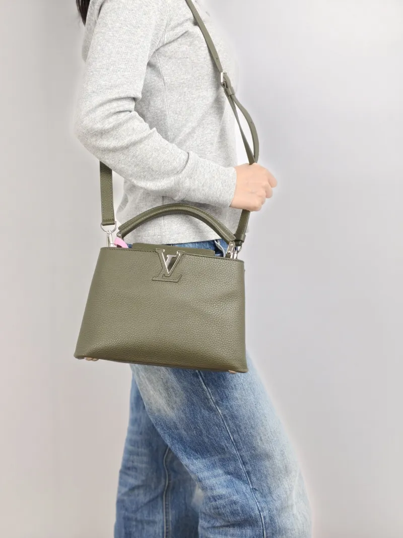 Louis Vuitton Top Handle Bag Capucines Calfskin BB 27 × 9 × 17.5 cm — on-model view 2 of 3