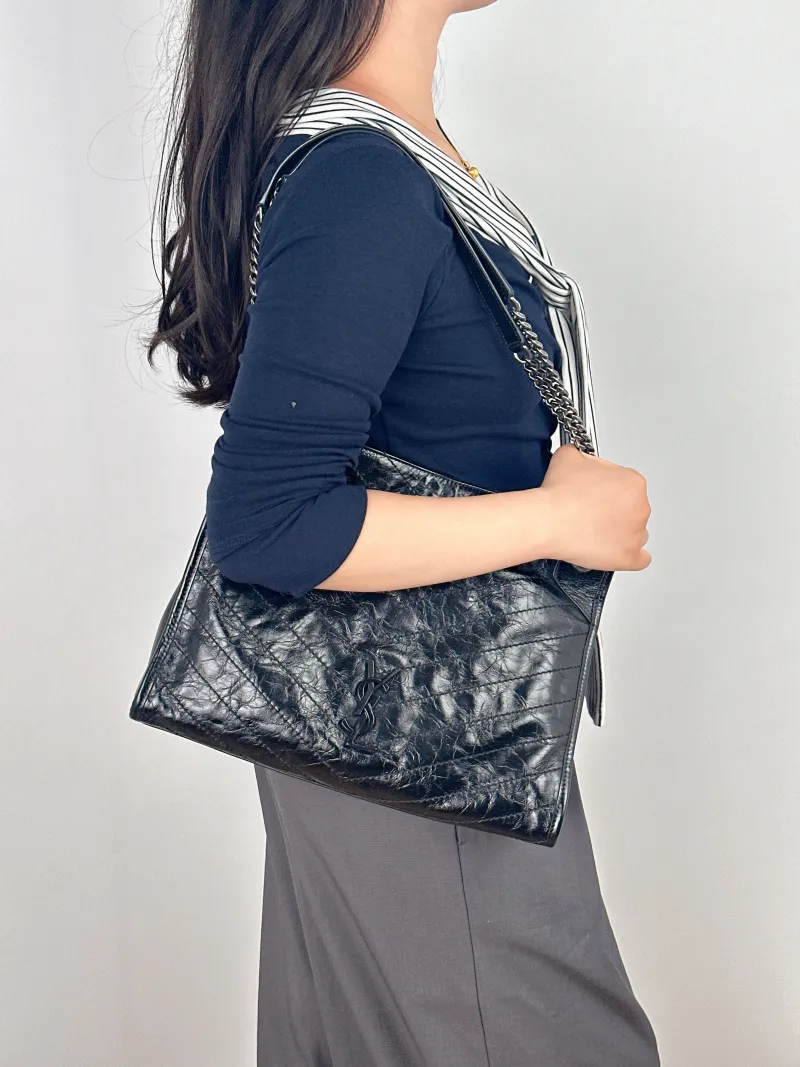 SAINT LAURENT Shoulder Bag NIKI SHOPPING Shopping Tote Black Waxed Leather Medium33 × 11.5 × 27 cm — on-model view 2 of 2