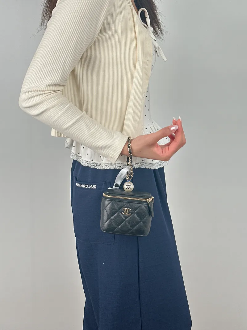 Chanel Top Handle Bag Edition Pearl Black Calfskin Mini 10 × 7 × 9 cm 31 — on-model view 2 of 2