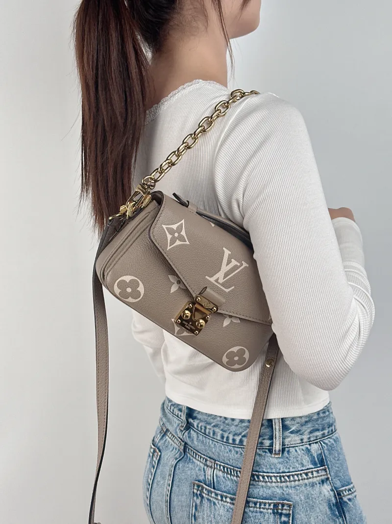 Louis Vuitton Crossbody Bag Pochette Métis East West Monogram Empreinte Embossed Calfskin Small 21.5 × 6 × 13.5 cm — on-model view 2 of 3