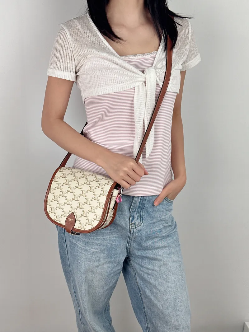 CELINE Crossbody Bag FOLCO White PVC Medium 18.5 × 8 × 17 cm — on-model view 2 of 2