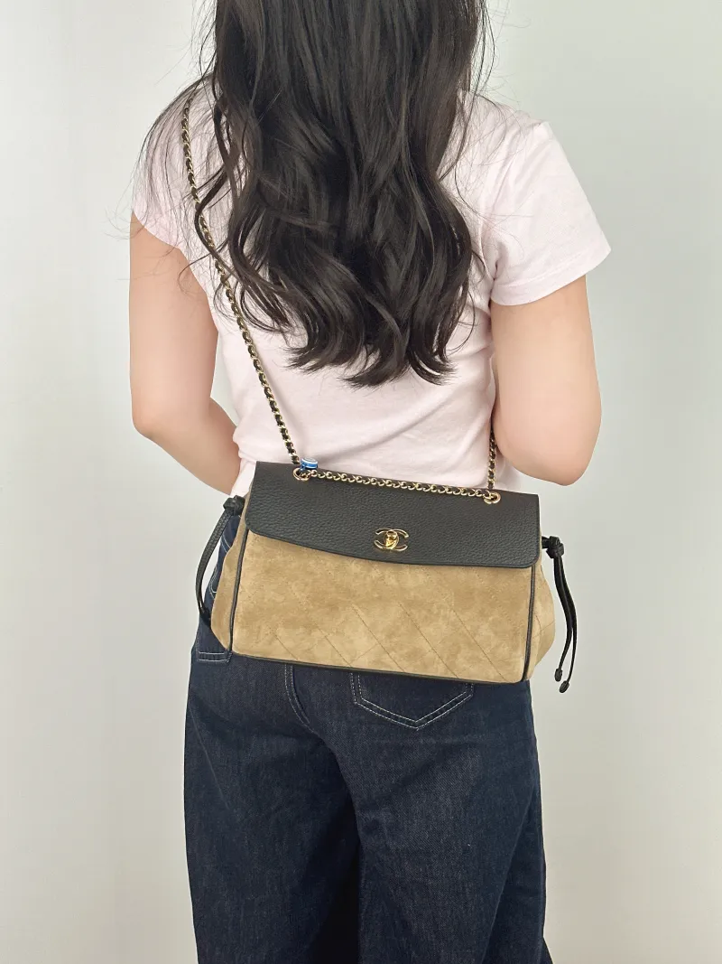 Chanel Shoulder Bag 26a Collection · Black Suede Small 29 × 10 × 17 cm — on-model view 1 of 2