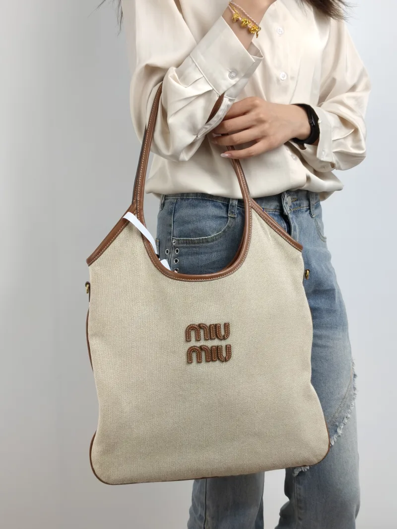 Miumiu Shoulder Bag IVY Tote Shopping Tote Beige Brown Canvas Medium 35*40 — on-model view 1 of 2