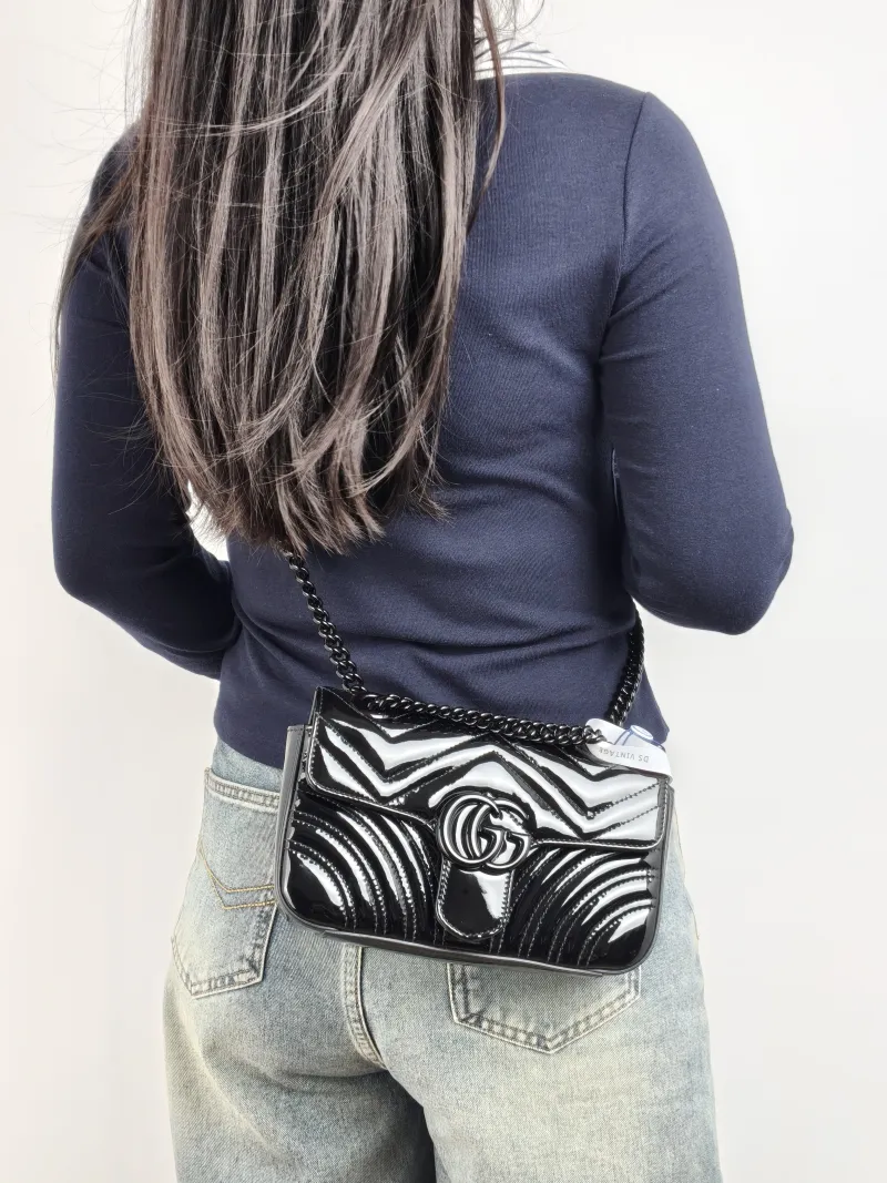 GUCCI Crossbody Bag GG Marmont Small Marmont So Black 22 Black Patent Leather Small 22 × 6 × 13 cm — on-model view 1 of 2