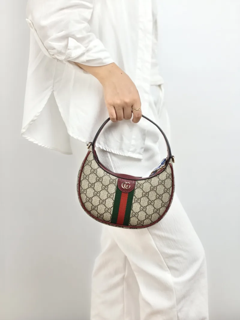 GUCCI Crossbody Bag Ophidia GG Monogram PVC Small 20 × 5 × 11 cm — on-model view 2 of 2