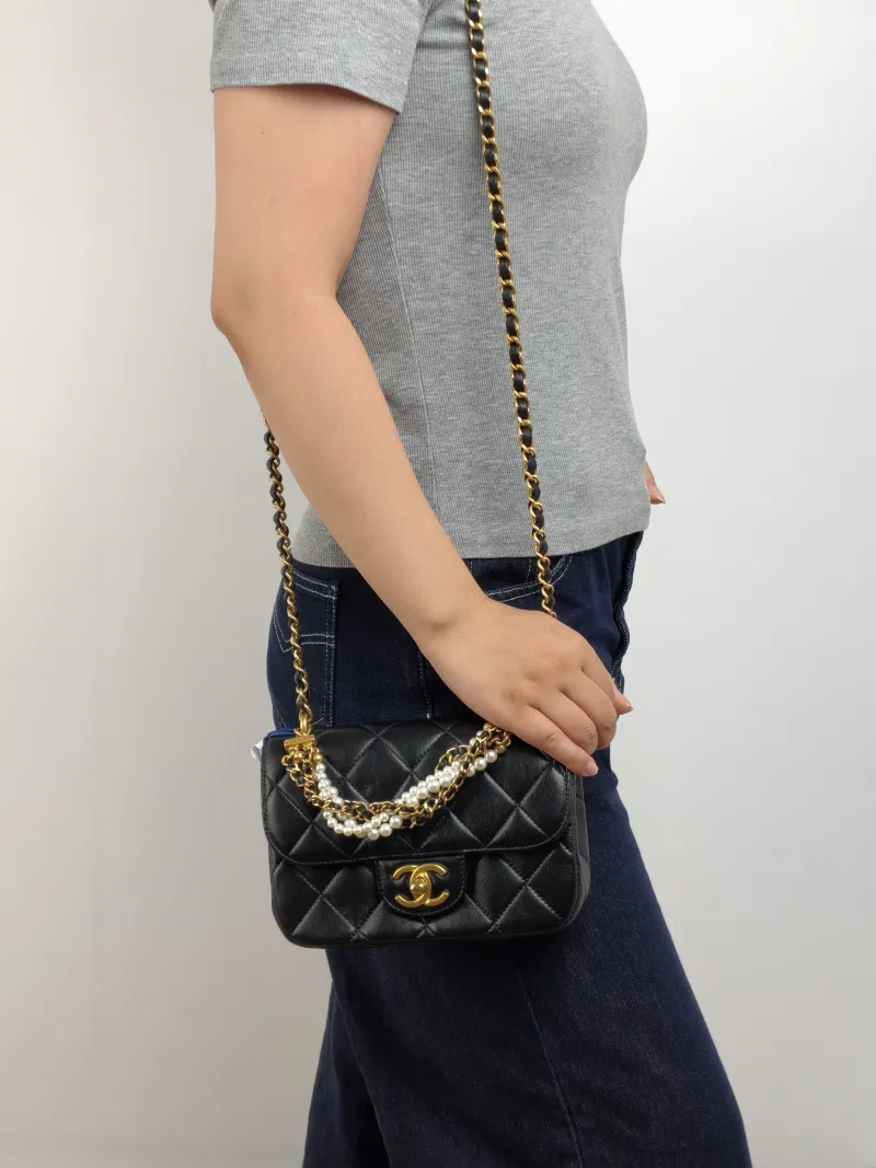 Chanel Crossbody Bag 26c Pearl Black Lambskin Small 20 × 6 × 14 cm — on-model view 2 of 3