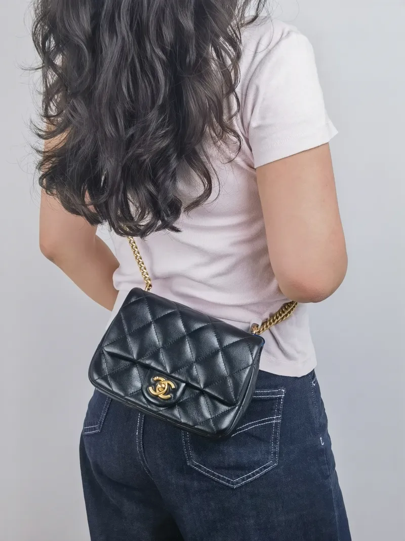Chanel Crossbody Bag 23p Black Lambskin Mini 20 × 8 × 14 cm — on-model view 1 of 2