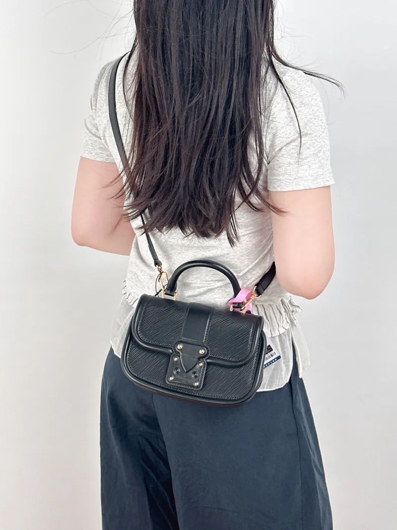 Louis Vuitton Crossbody Bag Hide and Seek Messenger Bag Black Epi Embossed Calfskin One Size21 × 8 × 15 cm — on-model view 2 of 3