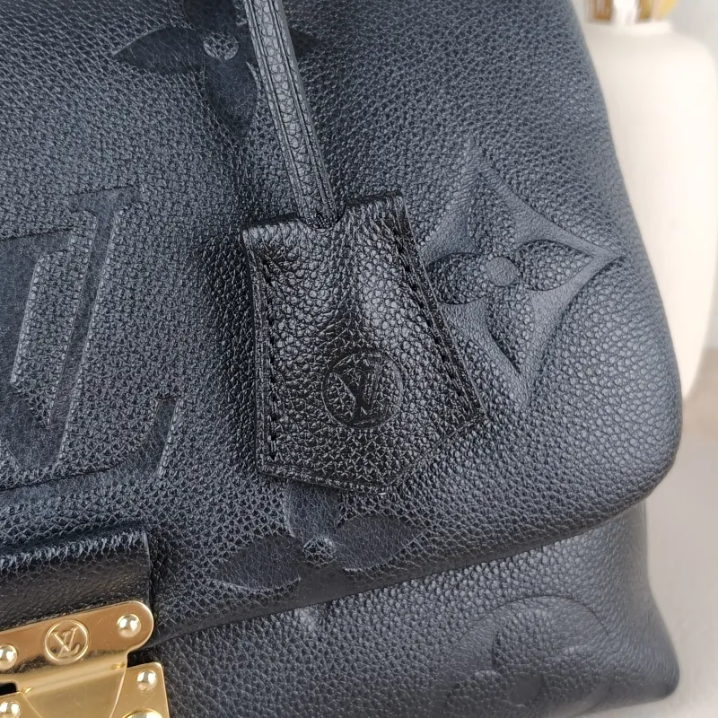 Louis Vuitton Crossbody Bag MADELEINE Black Monogram Empreinte Embossed Calfskin Medium 30 × 11 × 19.5 cm — detail view 11 of 13