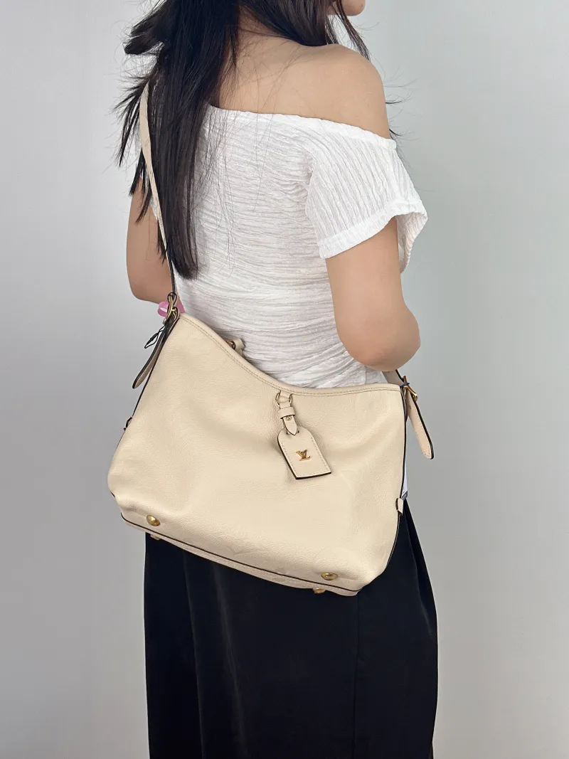 Louis Vuitton Crossbody Bag Carryall White Calfskin Small 29.5 × 12 × 24 cm — on-model view 2 of 2