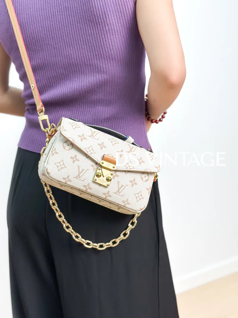 Louis Vuitton Crossbody Bag Pochette Métis East West PVC Small 21.5 × 6 × 13.5 cm — on-model view 2 of 4