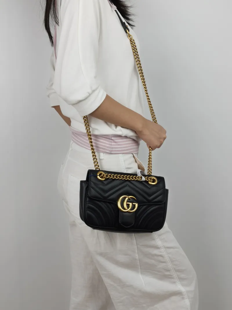 GUCCI Crossbody Bag GG Marmont Small Marmont 22 Black CC alfskin Small 22 × 6 × 13 cm — on-model view 1 of 3