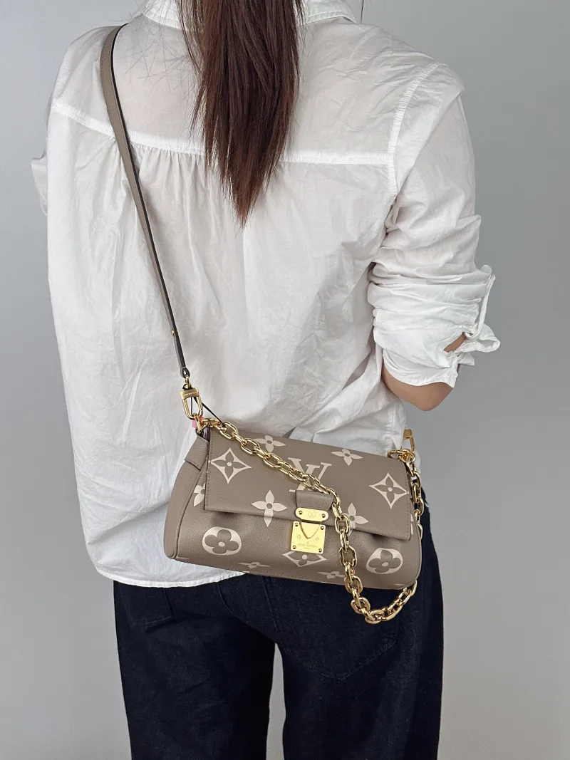 Louis Vuitton Crossbody Bag Favorite Empreinte Embossed Calfskin Medium24 × 9 × 14 cm — on-model view 1 of 3