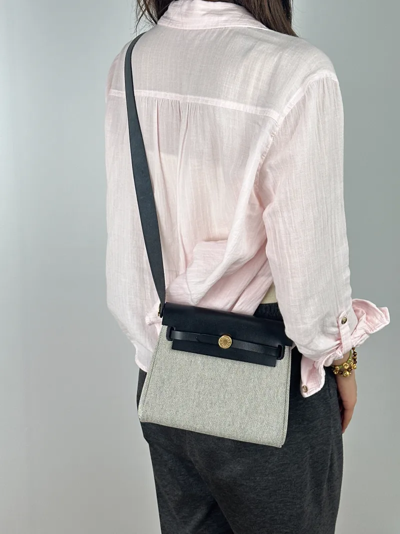 Hermès Crossbody Bag Herbag Zip 20Black Beige Canvas mini20.5 × 7 × 16.5 cm — on-model view 2 of 2