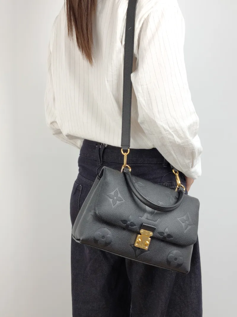 Louis Vuitton Crossbody Bag MADELEINE Black Monogram Empreinte Embossed Calfskin Medium 30 × 11 × 19.5 cm — on-model view 2 of 3