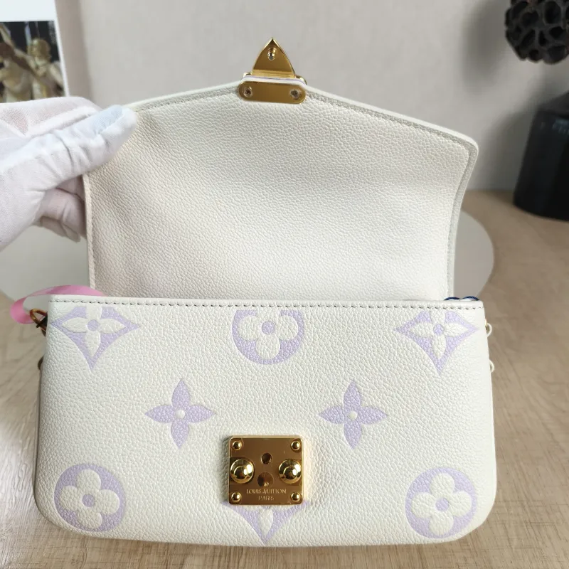 Louis Vuitton Crossbody Bag Pochette Métis East West White · Monogram Empreinte Embossed Calfskin Small 21.5 × 6 × 13.5 cm — detail view 9 of 11
