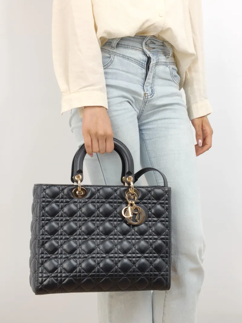 DIOR Top Handle Bag Lady Lady Dior Bag Black Lambskin Large 32 × 11 × 25 cm — on-model view 1 of 2