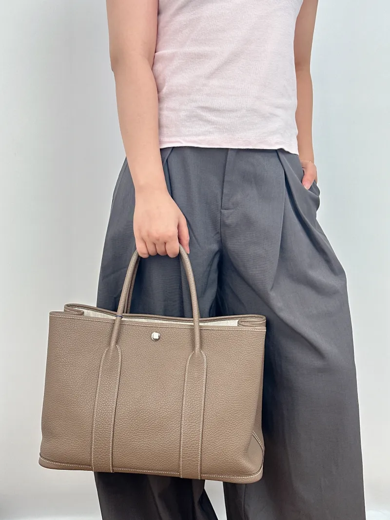 Hermès Top Handle Bag Garden Party 36 36 Negonda Calfskin Large 36 × 17 × 26 cm z — on-model view 1 of 2