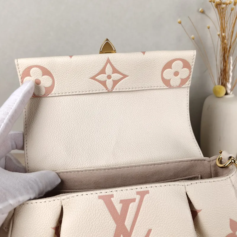 Louis Vuitton Crossbody Bag Favorite White · Pink Empreinte Embossed Calfskin Monogram Medium24 × 9 × 14 cm — detail view 6 of 12