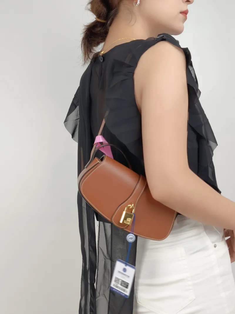 CELINE Crossbody Bag TABOU Brown Calfskinmini18 × 5 × 8 cm — on-model view 1 of 2