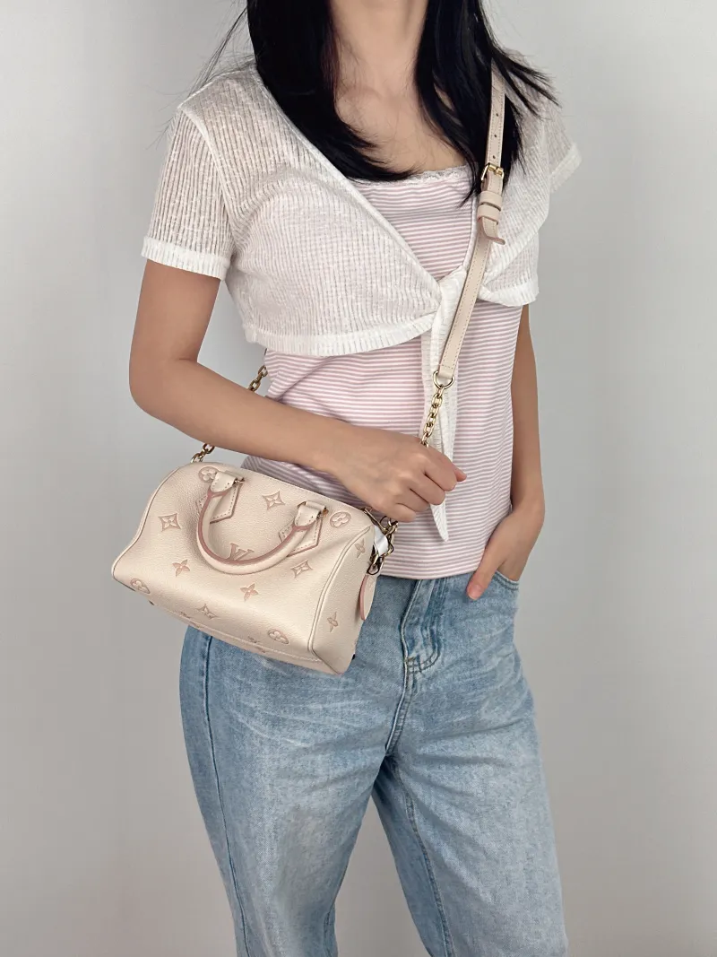 Louis Vuitton Crossbody Bag Speedy20Beige · Pink Empreinte Embossed Calfskin Small20.5 × 12 × 13.5 cm — on-model view 2 of 3