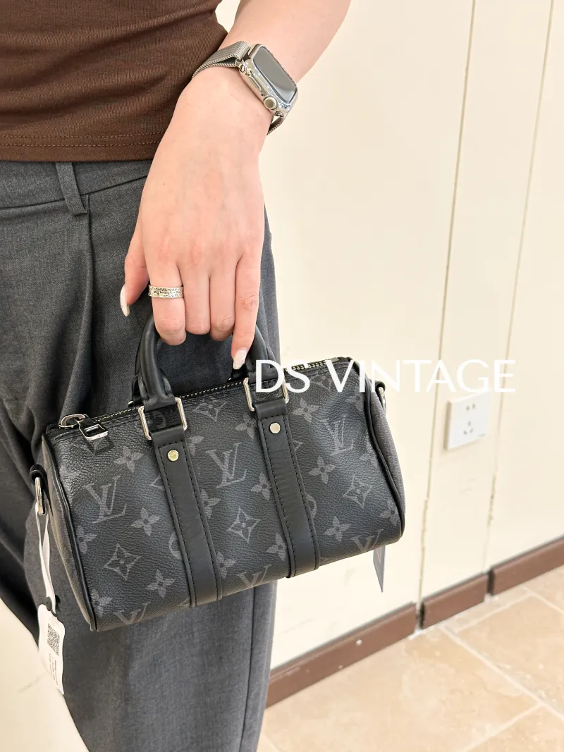 Louis Vuitton Crossbody Bag Keepall XS Monogram PVC Mini 21 × 9 × 12 cm — on-model view 2 of 6