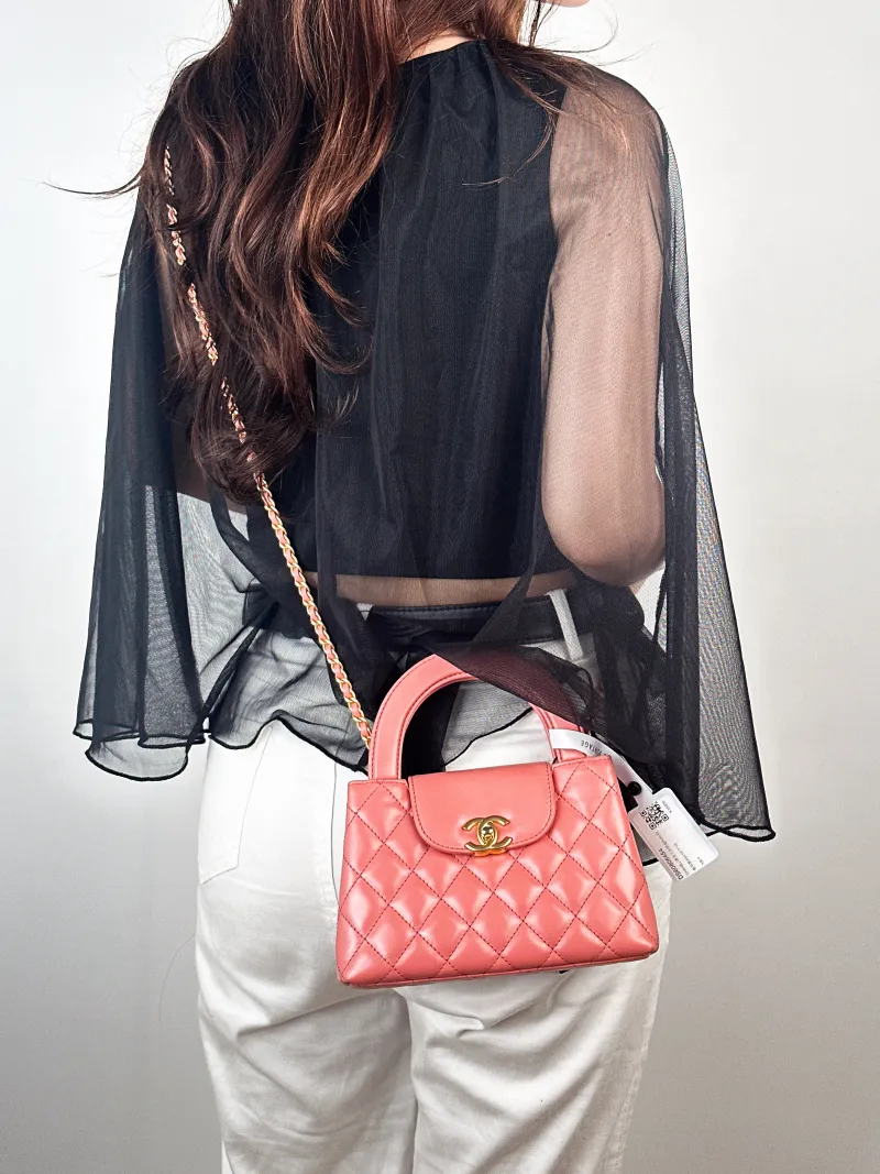 Chanel Crossbody Bag Kelly Pink Calfskinmini19 × 7 × 13 cm — on-model view 1 of 2