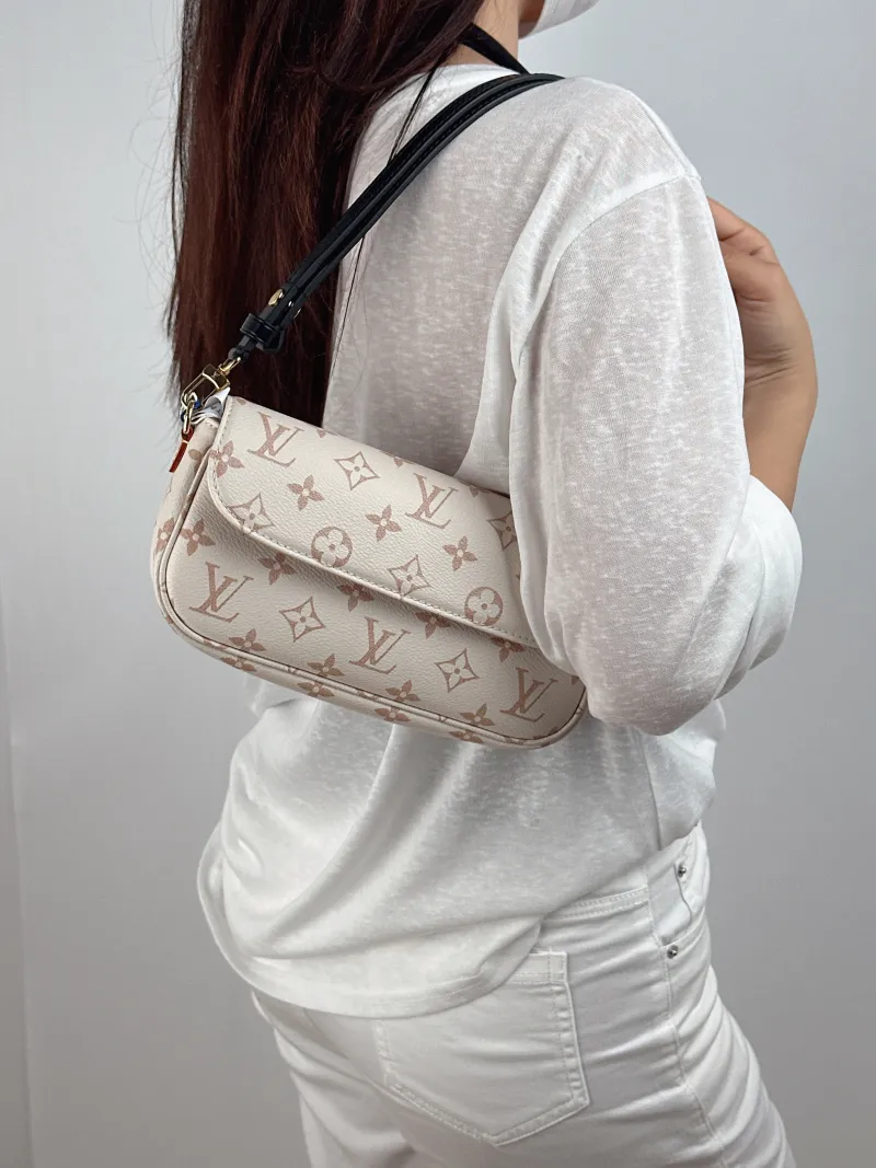 Louis Vuitton Crossbody Bag IVY · Beige PVC Small 23.5 × 4.3 × 12 cm — on-model view 2 of 2
