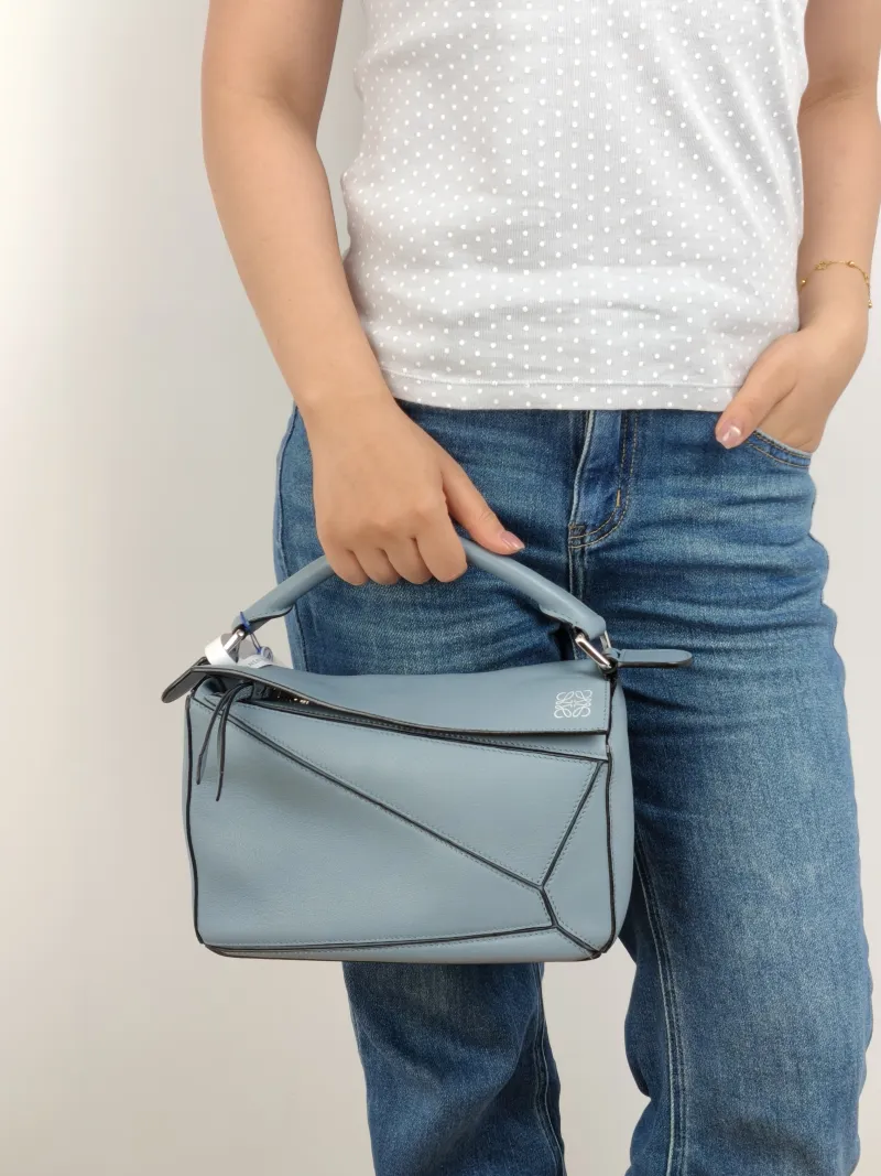 LOEWE Crossbody Bag Puzzle Blue CC alfskin Small 24 × 10.5 × 16.5 cm — on-model view 2 of 2