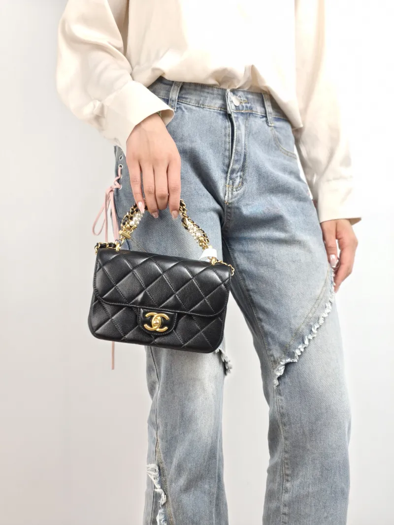 Chanel Crossbody Bag Pearl Black Lambskin Mini 19 × 5.5 × 12.5 cm — on-model view 2 of 2