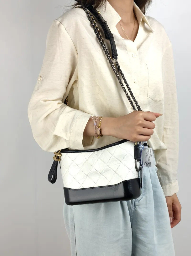 Chanel Crossbody Bag Gabrielle Gabrielle Bag CC alfskin Small 20 × 8 × 15 cm 29 — on-model view 1 of 2
