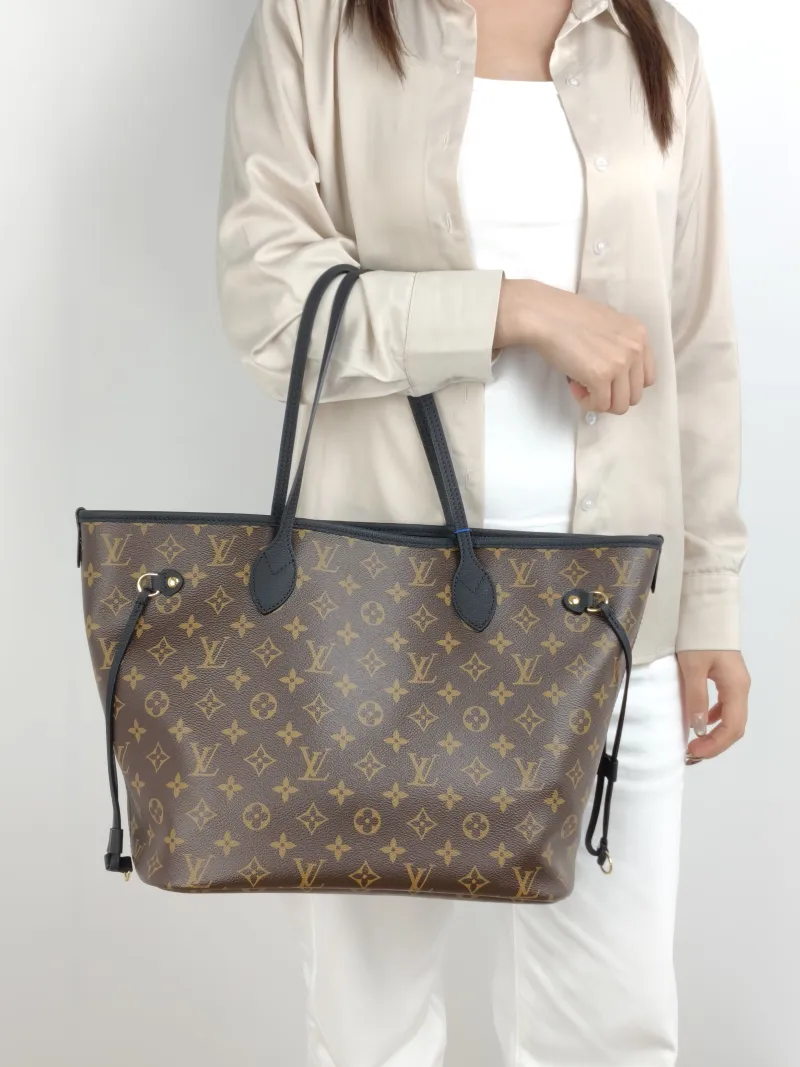 Louis Vuitton Shoulder Bag NEVERFULL INSIDE OUT Black PVC · Calfskin Medium 31 × 14 × 28 cm — on-model view 1 of 2