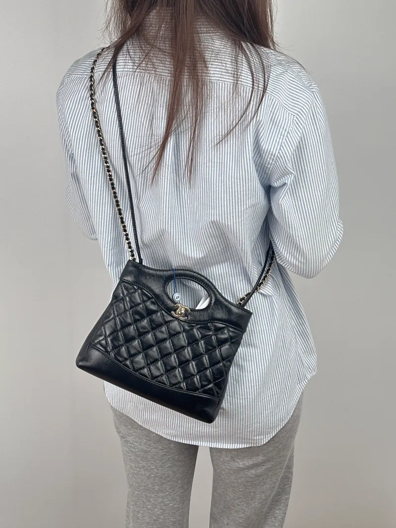 Chanel Crossbody Bag31Bag Black Waxed Leathermini23 × 5.5 × 22 cm — on-model view 2 of 3