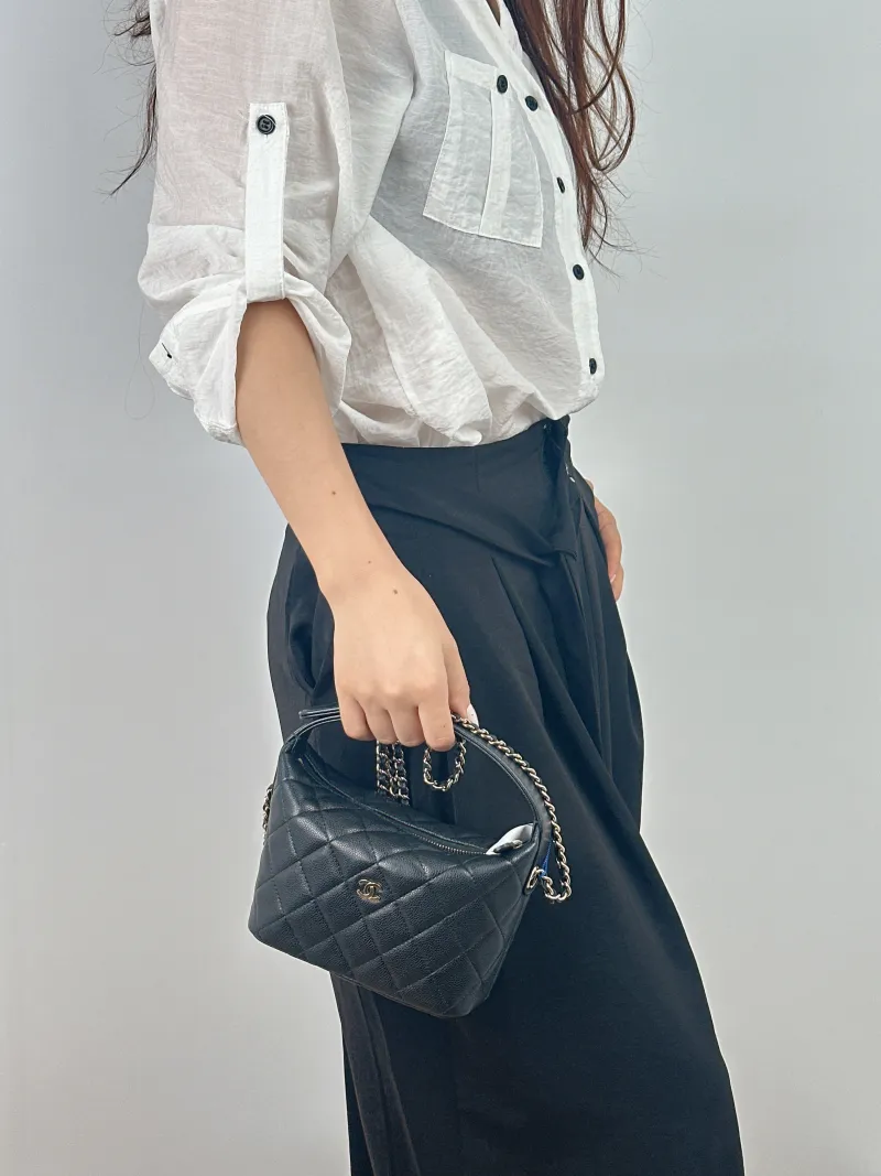 Chanel Crossbody Bag Crossbody Bag Black Grained Calfskin 21.5 × 7.5 × 19 cm — on-model view 1 of 2