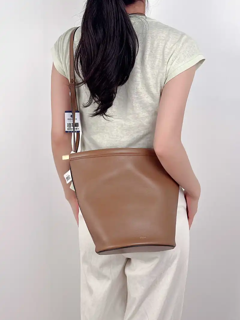 CELINE Crossbody Bag Clasp Bucket Bucket Bag Brown Calfskin One Size20 × 13.5 × 26 cm — on-model view 3 of 3