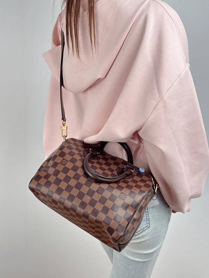 Louis Vuitton Top Handle Bag Speedy25 Shoulder Strap Edition- PVC Medium 25 × 15 × 19 cm — on-model view 1 of 2
