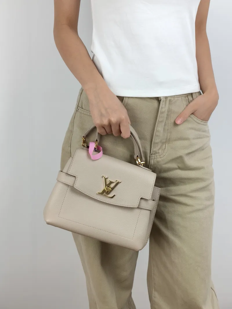 Louis Vuitton Crossbody Bag Lockme Ever Top Handle Bag Calfskin Mini 23 × 10 × 17 cm — on-model view 3 of 3