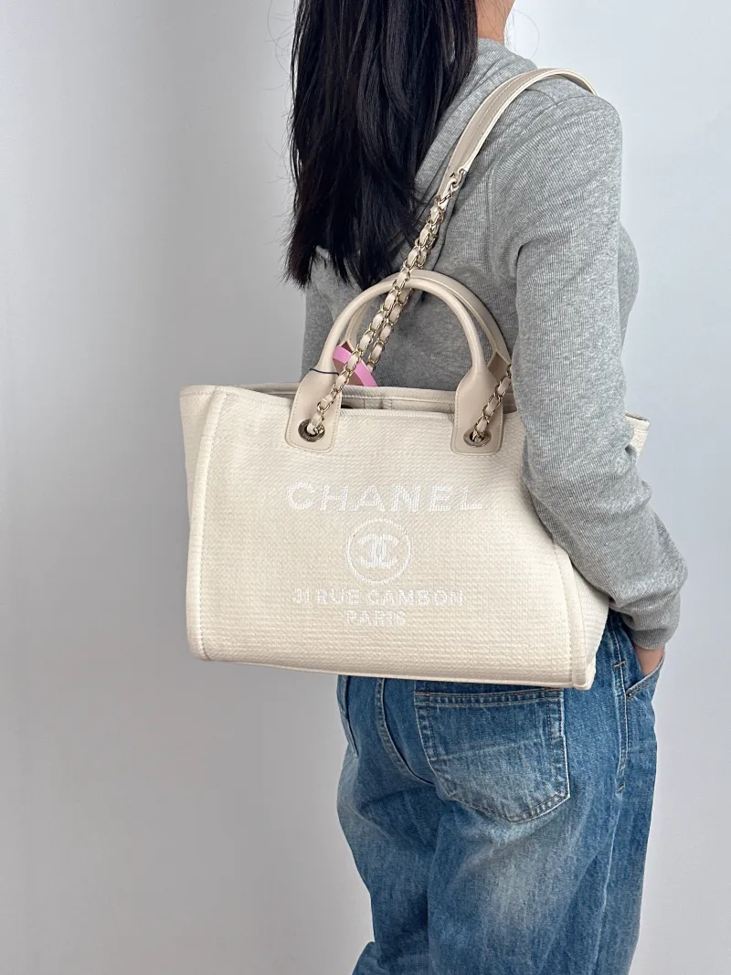 Chanel Shoulder Bag White Canvas One Size 32 × 16 × 23 cm — on-model view 2 of 2