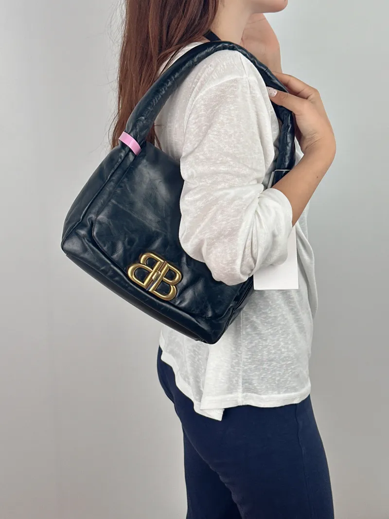 BALENCIAGA Shoulder Bag Shoulder Bag Black with Gold-Tone Hardware Calfskin One Size 25 × 9 × 19 cm — on-model view 1 of 2
