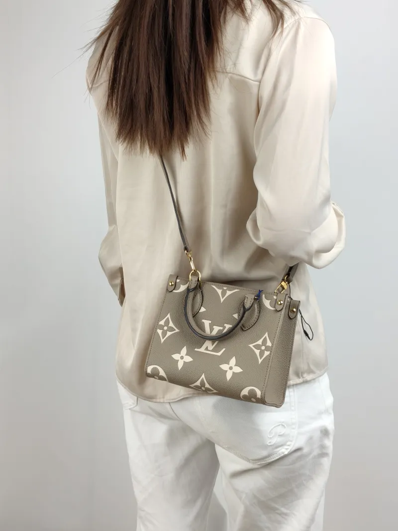 Louis Vuitton Crossbody Bag Onthego BB · White Monogram Empreinte Embossed Calfskin BB 18 × 8.5 × 15 cm — on-model view 2 of 3