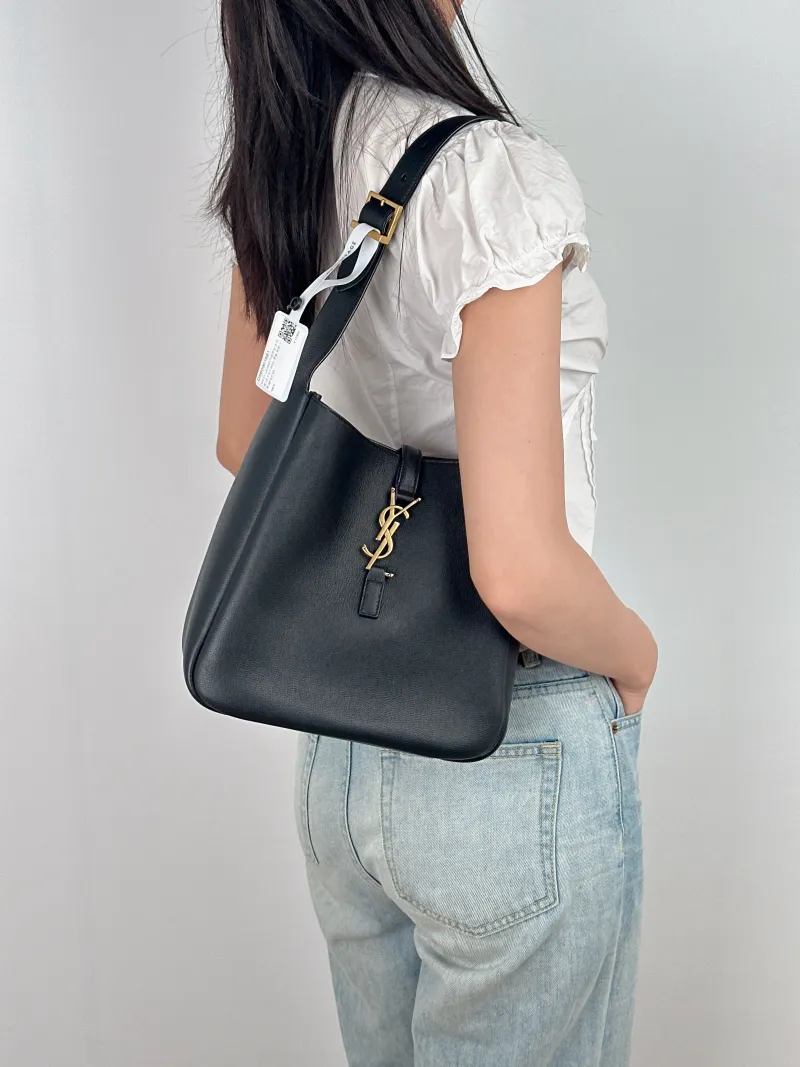 SAINT LAURENT Shoulder Bag LE 5 À 7 Hobo Black Calfskin Small 22 × 8.5 × 23 cm — on-model view 1 of 2