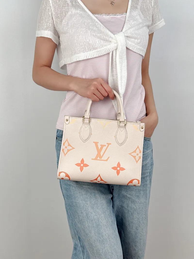 Louis Vuitton Shoulder Bag Onthego White Empreinte Embossed Calfskin Monogram Small25 × 11.5 × 19 cm — on-model view 2 of 3