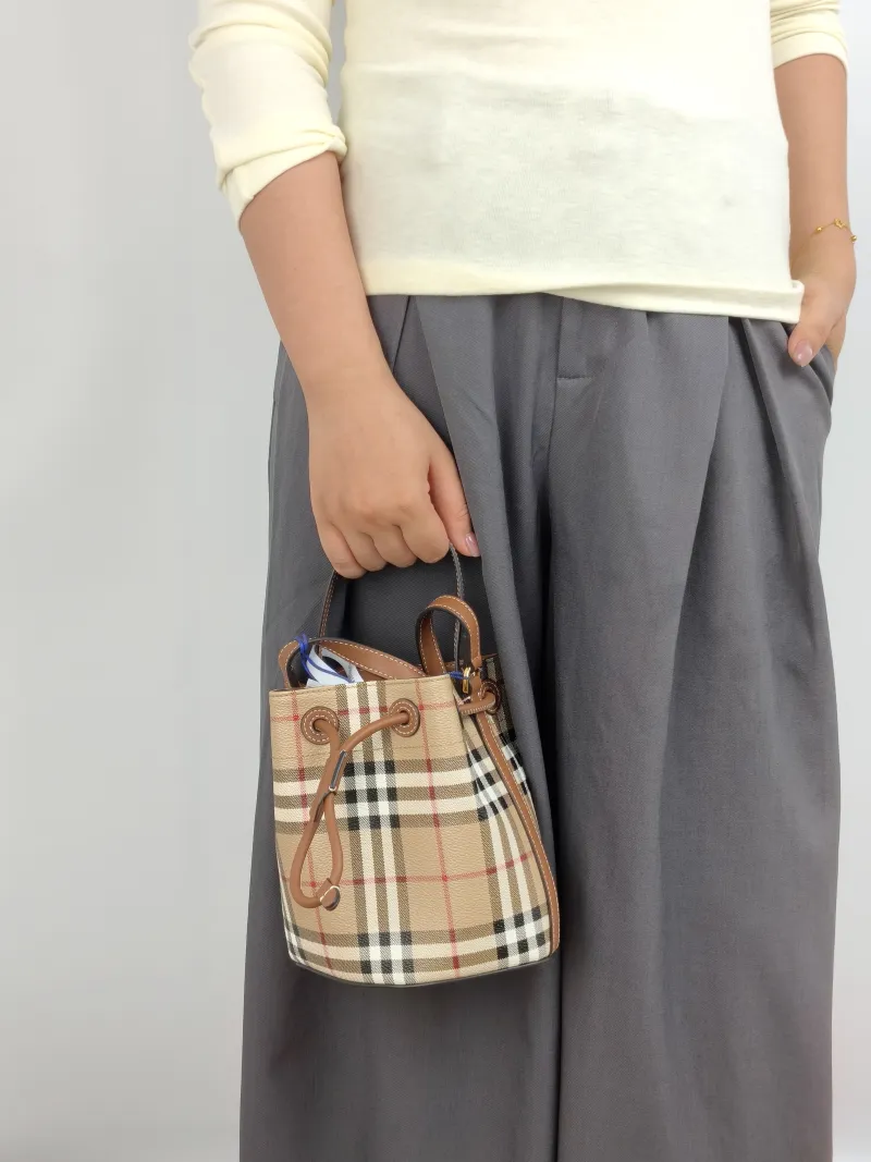 BURBERRY Crossbody Bag Bucket Bag Monogram PVC One Size 17 × 11 × 18 cm — on-model view 3 of 3
