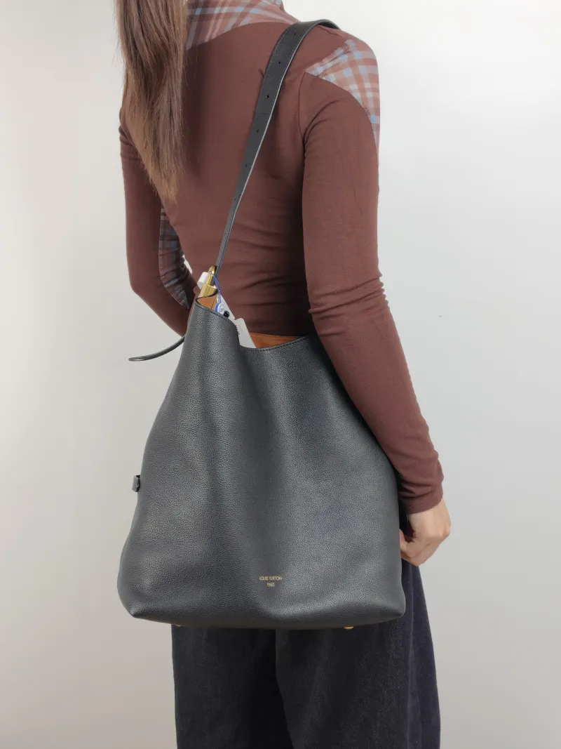 Louis Vuitton Shoulder Bag Low Key Hobo Shoulder Bag Black Calfskin Medium 31 × 18 × 35 cm — on-model view 1 of 2