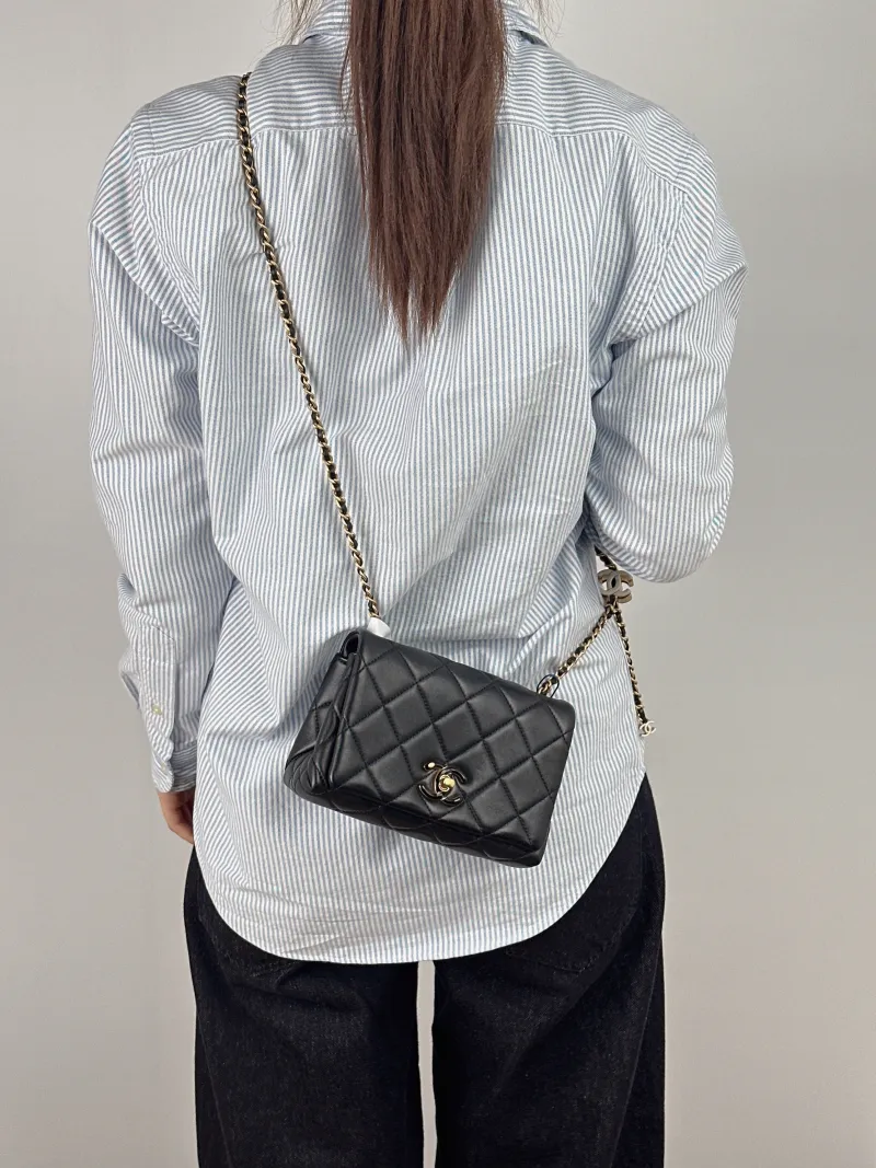 Chanel Crossbody Bag C Edition Black Lambskin Mini 18 × 7 × 12 cm — on-model view 1 of 2