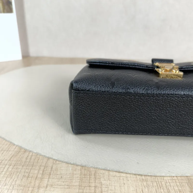 Louis Vuitton Crossbody Bag MADELEINE Black Monogram Empreinte Embossed Calfskin nano 21 × 6 × 12.5 cm — detail view 8 of 12