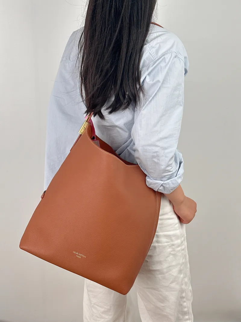 Louis Vuitton Shoulder Bag Low Key Hobo Shoulder Bag Calfskin Medium 31 × 18 × 35 cm — on-model view 1 of 2