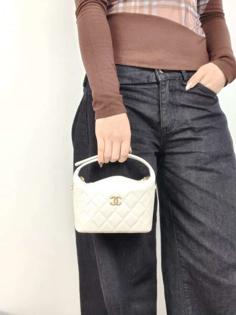 Chanel Crossbody Bag Crossbody Bag White Gold-Tone Hardware Grained Calfskin One Size 21.5 × 7.5 × 19 cm — on-model view 2 of 3